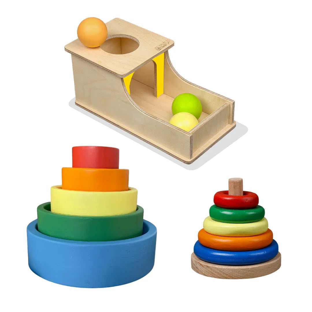BrainyTots Montessori learning kit including stacking rings, stacking cups and an object permanence toy for babies and toddlers.