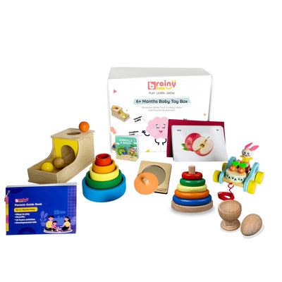 BrainyTots 6+ Months Baby Toy Box featuring Montessori wooden toys, flashcards, nesting bowls, stacking rings, object permanence box, and a parents' guide for early childhood development.
