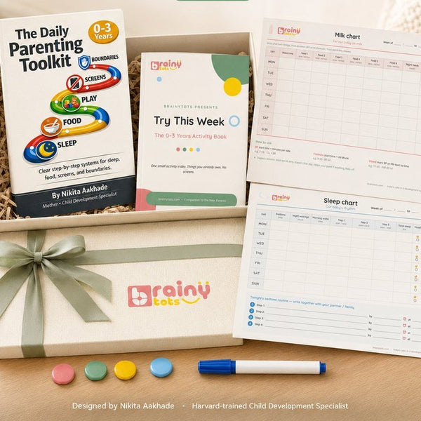 The Daily Parenting Toolkit book, Try This Week journal and routine charts in a gift box tied with a sage ribbon