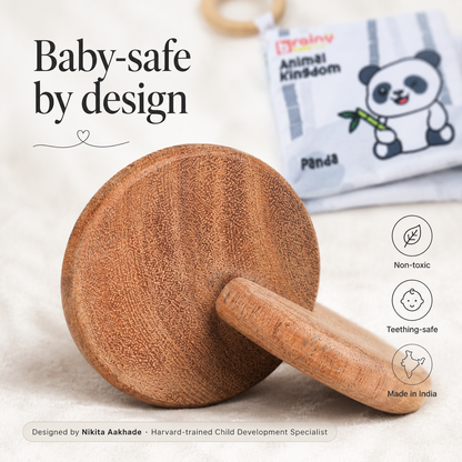 BrainyTots wooden baby toys for early grasping and sensory play, featuring smooth rounded pieces designed for small hands.
