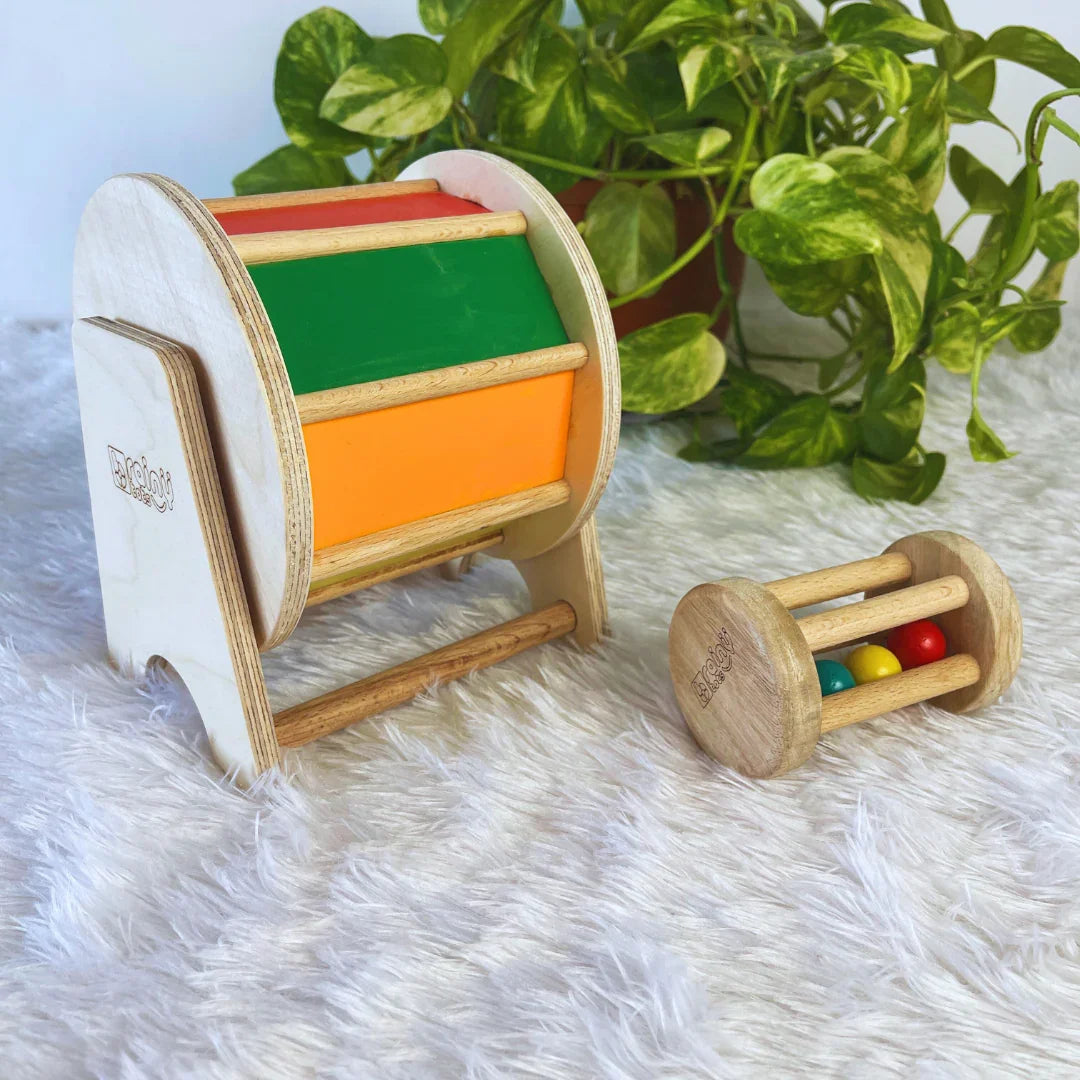 BrainyTots Baby Crawling Combo with Rainbow Spinning Wheel and Neem Wood Rolling Drum Rattle for babies aged 3+ months. Montessori tummy time toys that promote crawling, core strength, hand-eye coordination, auditory stimulation, sensory exploration, and early motor skill development.