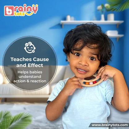 Child playing with the BrainyTots Montessori Banana Busy Beads Rattle, a natural wooden sensory toy that teaches cause-and-effect through wobbling movement, rattling sounds, and hands-on exploration for babies aged 2–18 months.