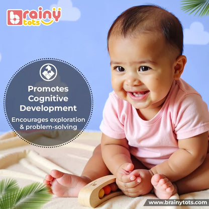 Baby exploring the BrainyTots Montessori Banana Busy Beads Rattle, encouraging cognitive development through hands-on exploration, discovery, and early problem-solving for babies aged 2–18 months.
