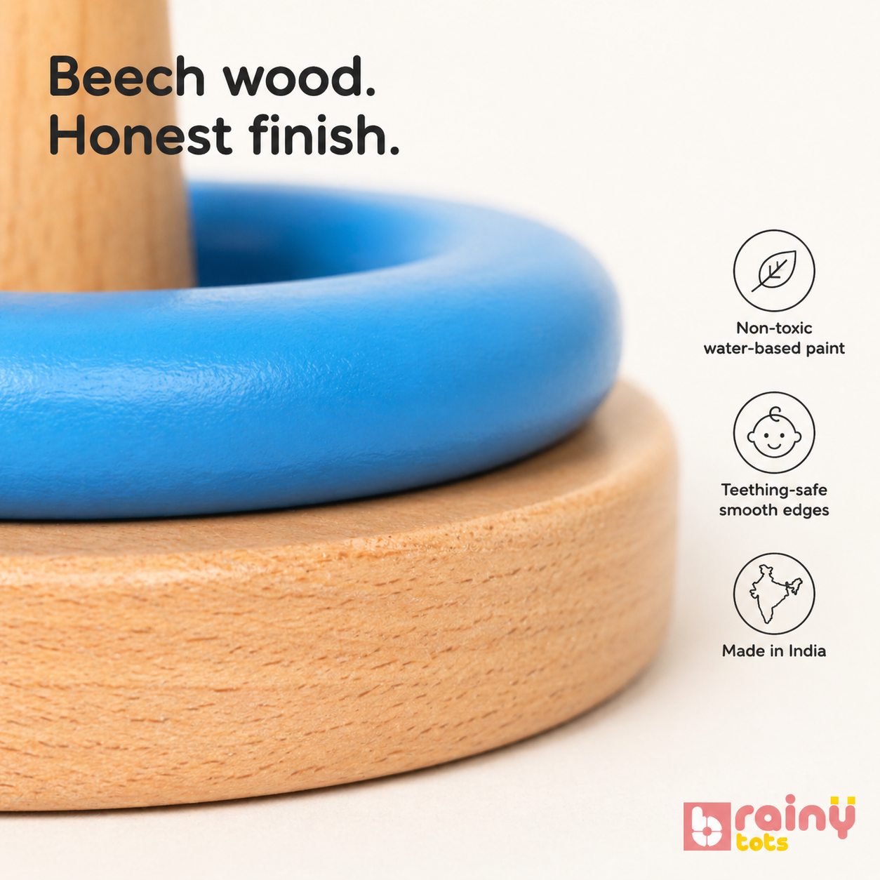 Close-up of the BrainyTots Wooden Ring Stacker showcasing premium natural beech wood, smooth teething-safe edges, and non-toxic water-based paint. Designed for babies aged 6+ months, this Montessori-inspired stacking toy supports safe sensory exploration, fine motor development, and independent learning.