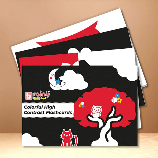 BrainyTots Colorful High Contrast Flashcards displayed on a wooden stand for infant visual stimulation.