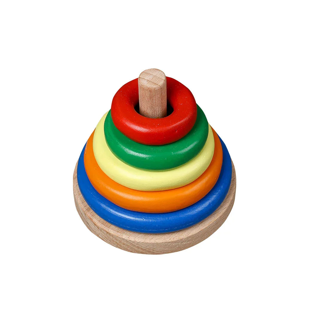 BrainyTots Wooden Ring Stacker with five colorful graduated rings on a natural wooden base, designed for babies aged 6–24 months to develop fine motor skills, hand-eye coordination, color recognition, size sequencing, problem-solving, and independent Montessori learning through hands-on play.