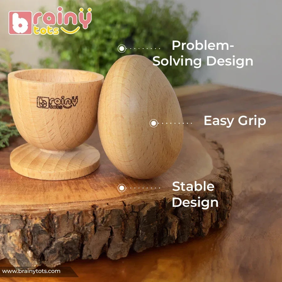 BrainyTots Egg & Cup Montessori Puzzle featuring a natural wooden egg and matching cup with an easy-to-grip, stable design. Designed for babies aged 6–24 months to develop fine motor skills, hand-eye coordination, balance, problem-solving, concentration, and independent Montessori learning through hands-on play.