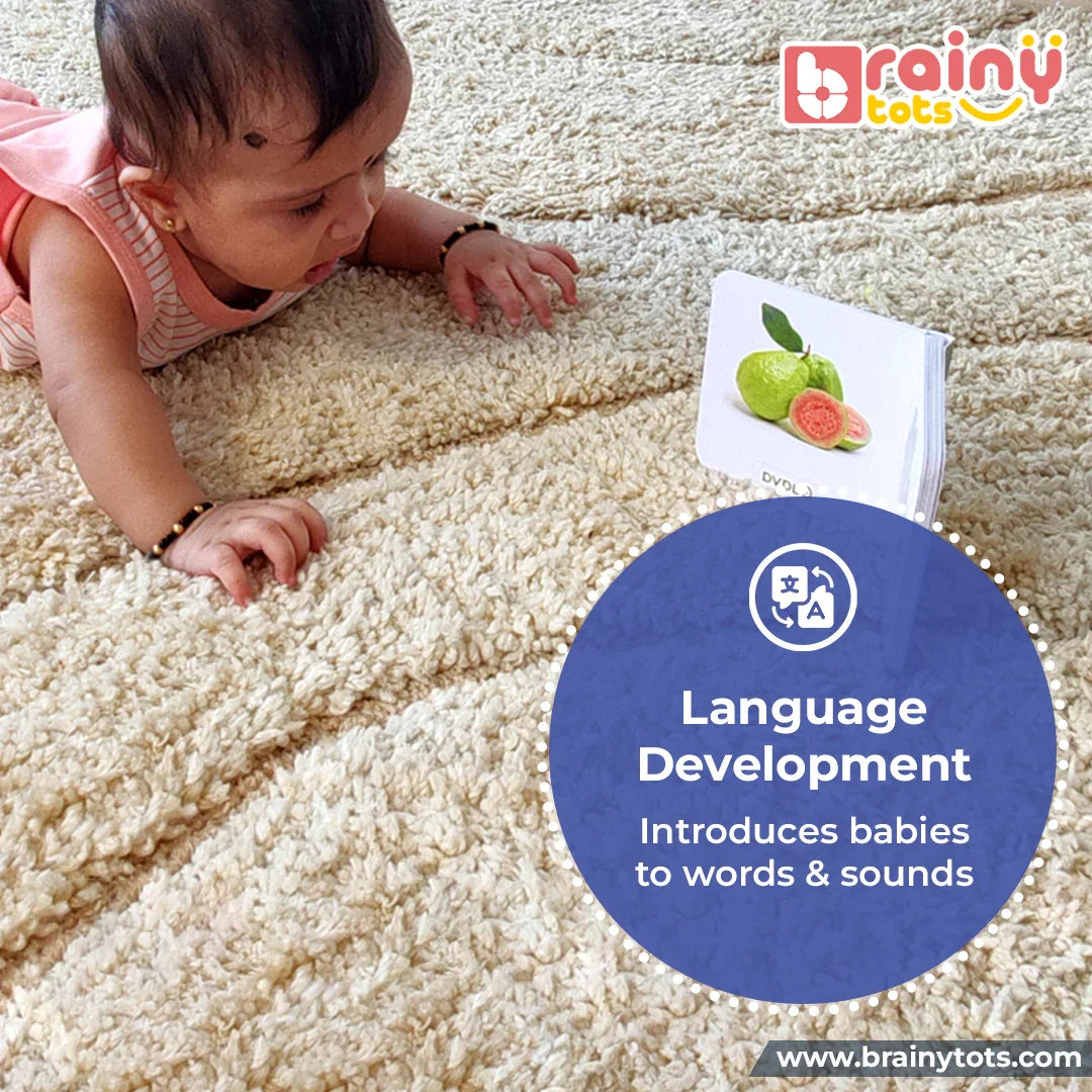 Baby exploring the BrainyTots Alphabet & Number Board Book with colorful fruit illustrations that support language development, introduce first words and sounds, and encourage early communication for babies aged 3+ months.