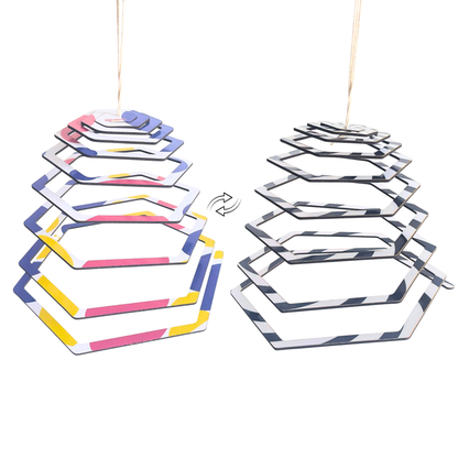 One mobile that grows with your baby. The BrainyTots Dual-Sided Hexagon Shaped Spiral Hanging Mobile begins with high-contrast patterns for newborn vision and transitions to vibrant colors as your baby's eyesight develops, encouraging calm observation, curiosity, and longer attention spans.