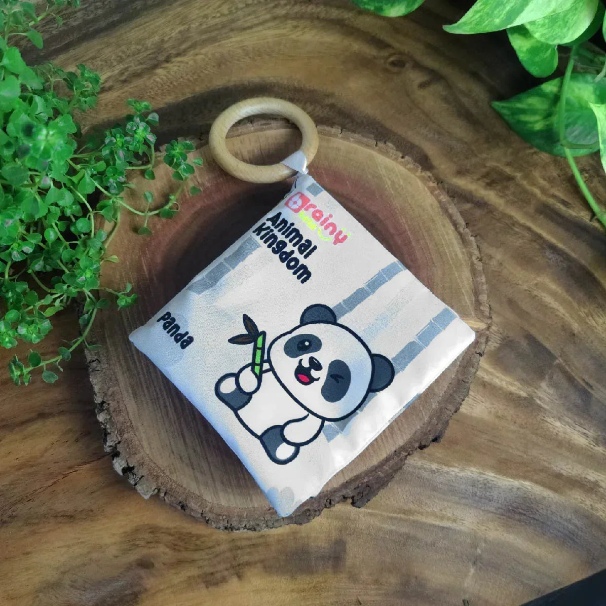 BrainyTots Montessori High-Contrast Cloth Book – Early Seeing & Calm Play Book for newborns aged 0–12 months. This soft jungle-themed crinkle sensory book with an attached natural Neem wood teether supports visual development, sensory exploration, teething relief, early language learning, and calm Montessori play.