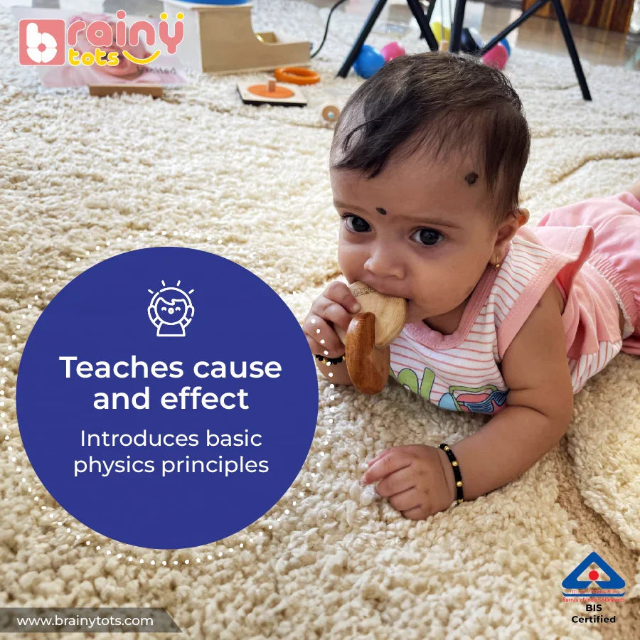  Baby exploring the BrainyTots Interlocking Discs Teether during tummy time and discovering its movement.