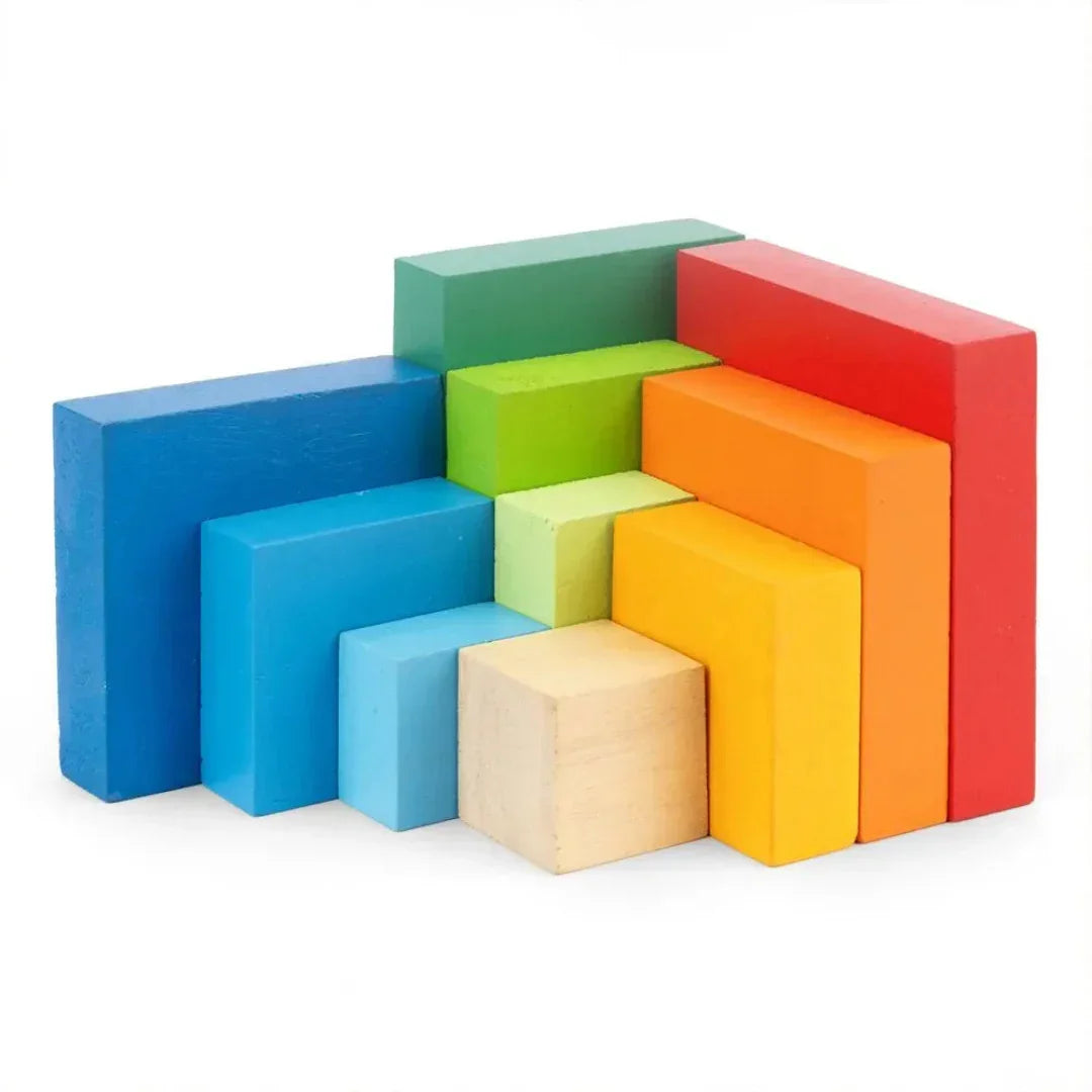 Individual pieces of the BrainyTots Montessori Geometric Rainbow Blocks – Shape & Balance Building Set for toddlers aged 24+ months. This colorful wooden block set includes multiple geometric shapes and sizes that encourage stacking, balancing, spatial awareness, creativity, problem-solving, and fine motor skill development through open-ended Montessori play.