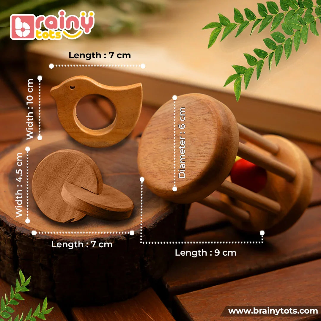 BrainyTots Montessori Neem Wood Teether Gift Set showing the dimensions of the Rolling Drum Rattle, Dove Teether, and Interlocking Discs for newborn babies.
