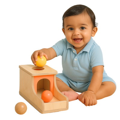 Baby playing with the BrainyTots Montessori Object Permanence Box, dropping a colorful wooden ball into the box to develop object permanence, hand-eye coordination, fine motor skills, problem-solving, and early cognitive development.