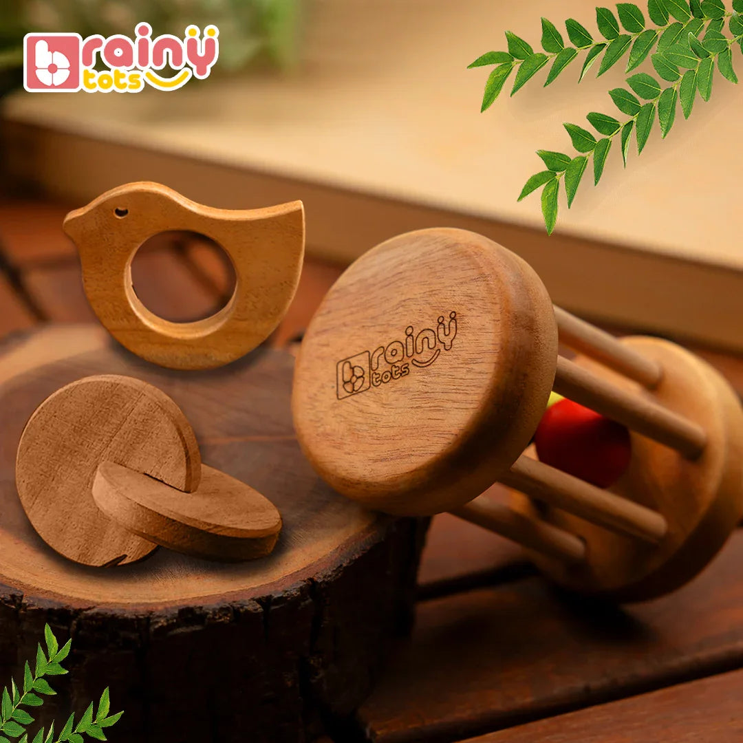 BrainyTots Neem Wood Teether Gift Set for newborn babies featuring a Montessori Rolling Drum Rattle, Dove Teether, and Interlocking Discs for safe teething, sensory play, and early motor development.