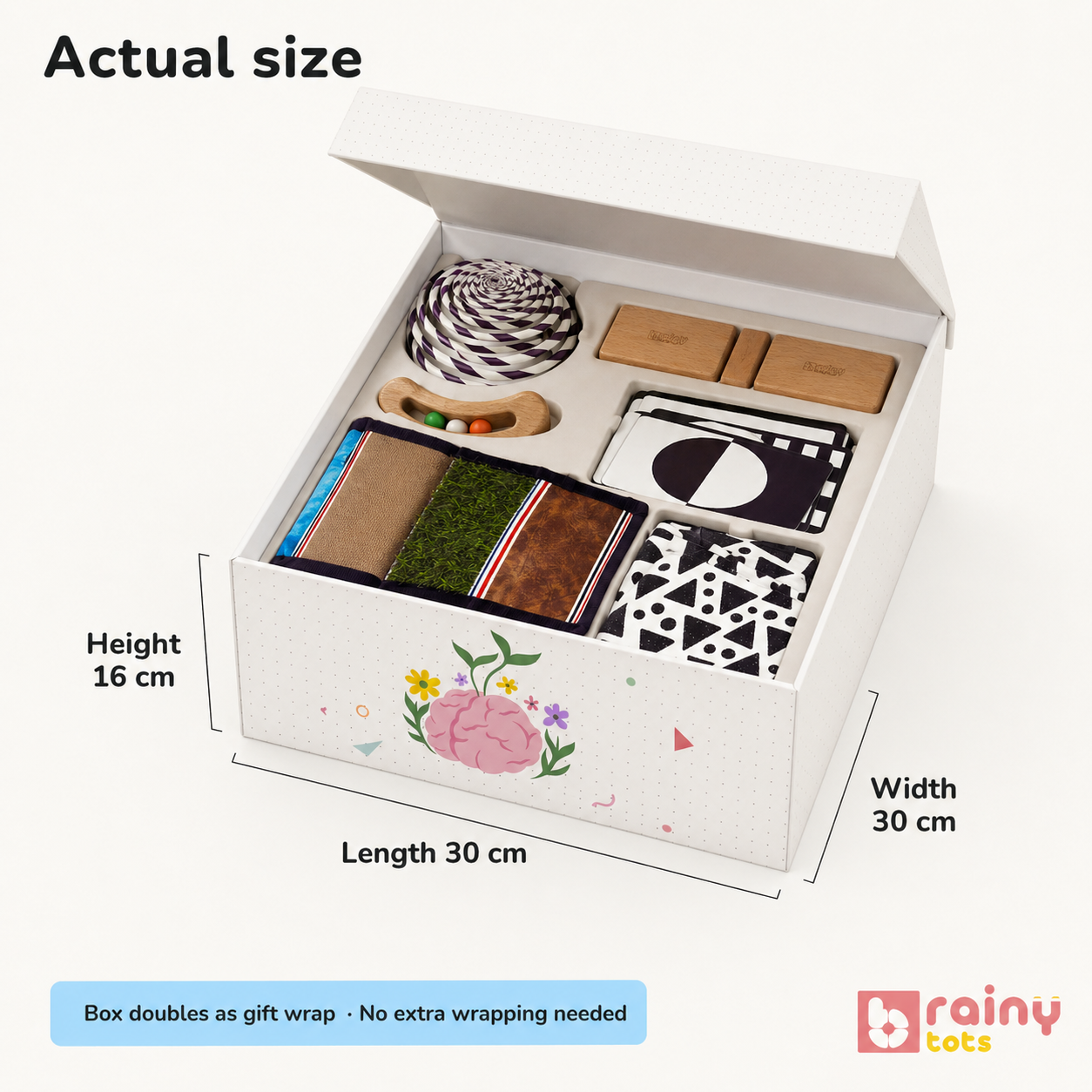 BrainyTots Newborn Sensory Gift Box showing the actual size of the 6-in-1 baby development kit with gift-ready packaging, high-contrast flashcards, sensory mat, hanging mobile, and wooden rattle for babies 0–6 months.
