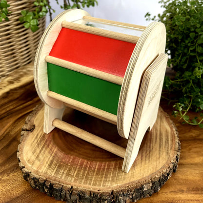 BrainyTots Rainbow Spinning Wheel Montessori toy for babies aged 3+ months, featuring colorful rotating panels, a built-in mirror, and rattle sounds to encourage tummy time, crawling, visual tracking, hand-eye coordination, cause-and-effect learning, and sensory development through self-guided play.