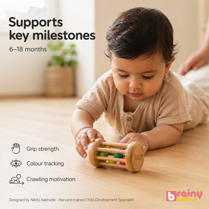 Baby playing with the BrainyTots rolling drum rattle while exploring movement and cause-and-effect through play.
