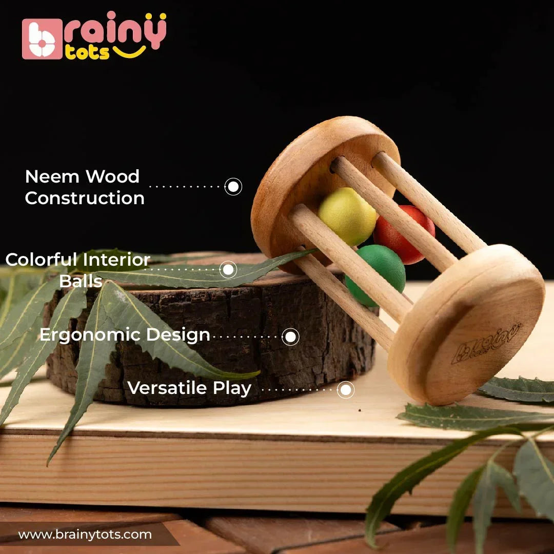 BrainyTots Montessori Rolling Drum Rattle made from natural neem wood with colorful interior beads, an ergonomic design, and durable baby-safe construction for sensory play and early development in babies aged 3–12 months.