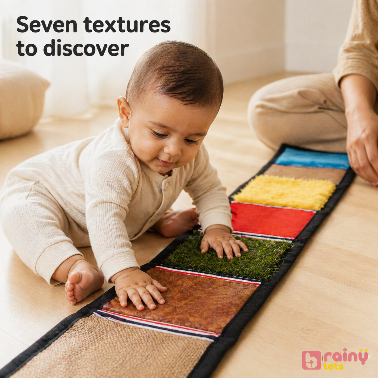 Baby exploring the BrainyTots sensory texture mat during floor play, developing tactile awareness, sensory processing, fine motor skills, and curiosity through seven unique textures for newborns 0–6 months.