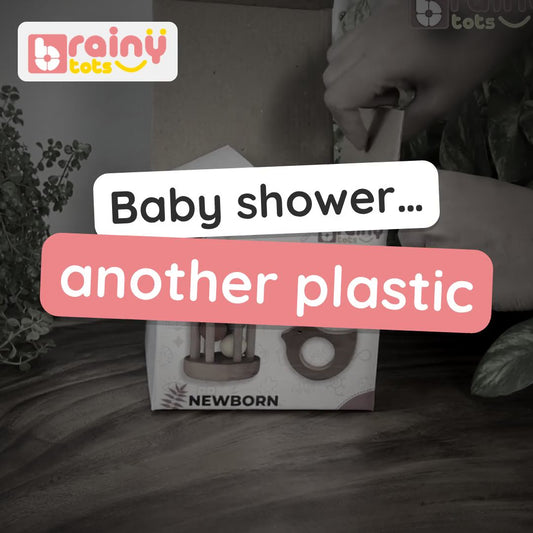 BrainyTots Newborn Neem Gift Box video: three neem wood toys – a dove teether, interlocking discs and a rolling drum rattle – with a play guide. Ages 3–12 months.