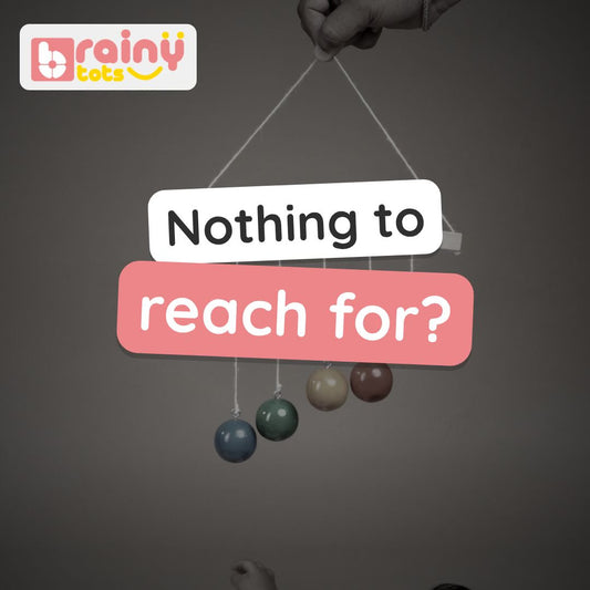 BrainyTots Hanging Balls video: five bright wooden balls hung at different heights for a baby to reach, swat and grab. Ages 3–12 months.