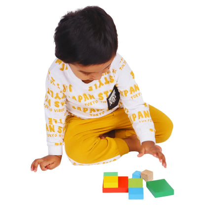 Toddler building a colorful tower with the BrainyTots Montessori Geometric Rainbow Blocks – Shape & Balance Building Set. Designed for children aged 24+ months, this Montessori-inspired wooden toy encourages creative building, spatial awareness, balance, problem-solving, logical thinking, hand-eye coordination, and fine motor skill development through open-ended play.