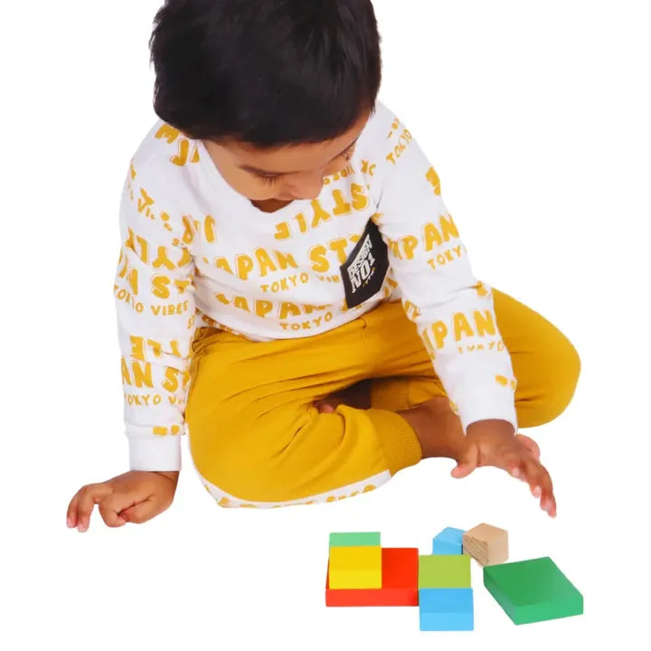 Toddler building with the geometric rainbow blocks